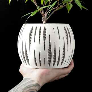 3D printed plant pot with unique geometric design, perfect for modern home decor and indoor plants.