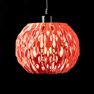 Elegant 3D-printed pendant lamp featuring complex cutout patterns for contemporary interior design.