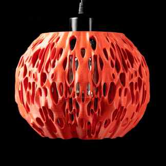 Pendant with complex 3D printed lattice structure, highlighting modern 3D printing technology and craftsmanship.