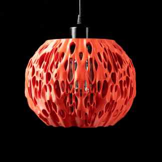 Stylish 3D-printed orange pendant lamp featuring an intricate openwork design for modern interiors.