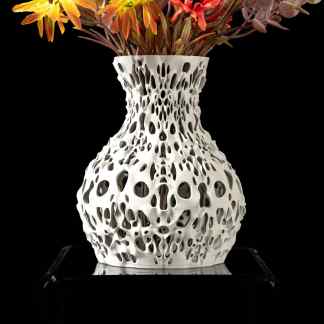 Vibrant artificial flowers in a modern, intricately designed 3D printed white vase on a black background.