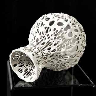 Highly detailed white 3D printed vase with intricate open lattice design, modern art sculpture.