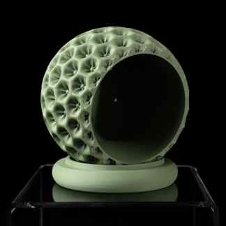 High-resolution 3D printed artistic sphere with intricate surface texture, showcasing advanced digital fabrication.