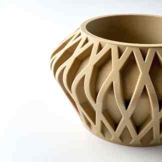 Detailed beige 3D printed geometric vase with intricate surface design.