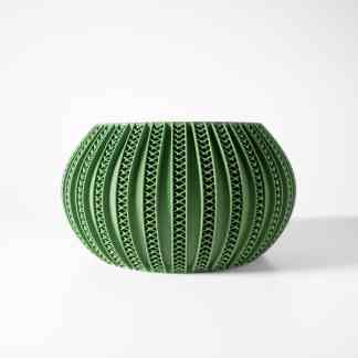 Highly detailed green 3D printed vase with complex geometric designs, highlighting innovative 3D printing solutions.