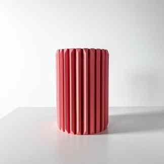 Pink 3D printed vase with a modern geometric design, perfect for interior decor and artistic presentations.