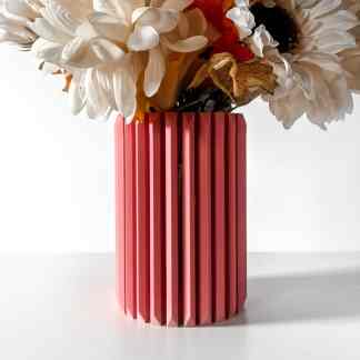 3D printed pink vase, textured vertical design, for home decor and floral arrangements.