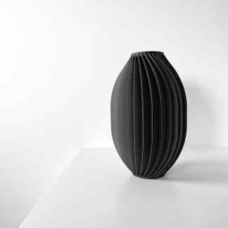 Sleek, ribbed black TIVANO vase perfect for modern interior decoration and floral arrangements.