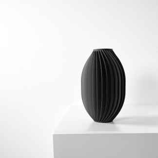 Elegant black 3D printed vase with vertical ridges, perfect for contemporary interior styling.