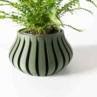 3D printed green plant pot showcasing innovative eco-friendly home decor with modern design.