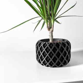 Stylish black planter with intricate lattice design for home décor and office plants.