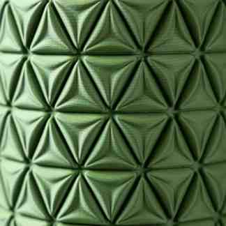 Close-up of textured green 3D geometric pattern highlighting modern design and structure.