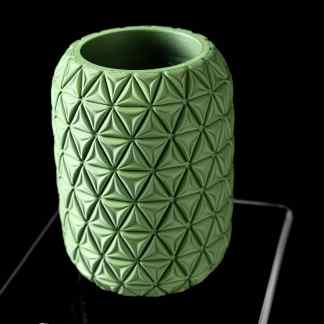 Highly detailed 3D-printed green vase with geometric surface, perfect for home decor.