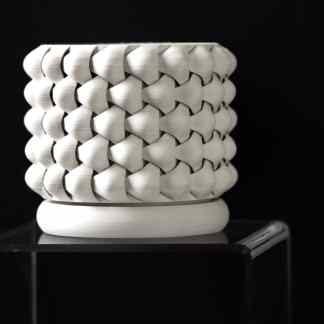 Sleek 3D printed geometric sculpture highlighting modern design and creative craftsmanship.