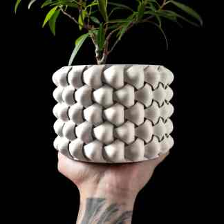 Modern 3D-printed flower pot showcasing intricate design and craftsmanship for home decor.