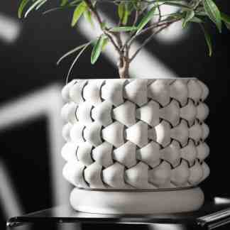 Detailed 3D printed plant pot with complex woven pattern, perfect for modern interior décor.