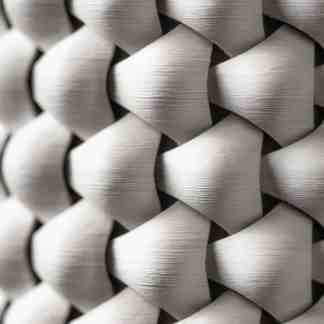 Detailed 3D printed metal mesh pattern, showcasing advanced additive manufacturing technology.