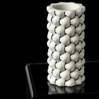 Detailed 3D printed Triweave vase with intricate woven pattern, perfect for stylish interior decor.