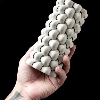 High-resolution 3D-printed sculptural artwork on black background.