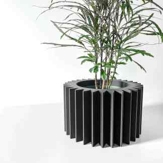 3D printed plant pot with geometric design, eco-friendly material, and sleek black finish, perfect for home decor.