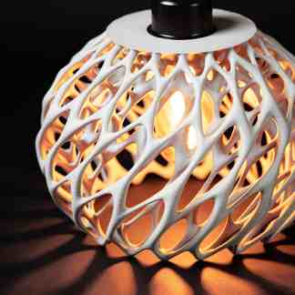 Elegant 3D-printed pendant lamp with detailed patterns and warm glow, perfect for modern interior decor.