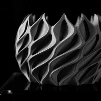 Highly detailed 3D printed art piece featuring complex geometric patterns for innovative design.