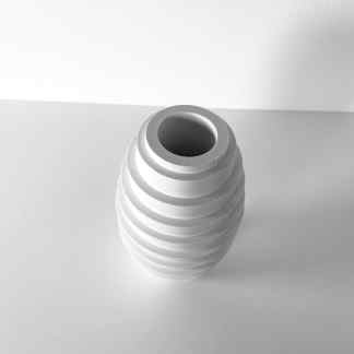 A modern, monochrome 3D-printed vase featuring a layered, spiral pattern with a hollow top.