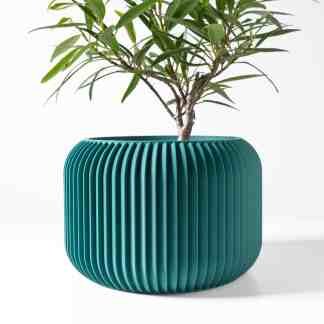 Vibrant teal 3D-printed plant pot with ribbed texture, perfect for home decor.