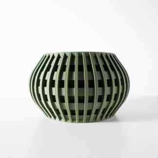 3D printed green geometric vase with lattice structure, showcasing innovative design.