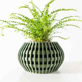 Green 3D-printed plant pot with lattice structure, perfect for home decor and showcasing 3D printing capabilities.