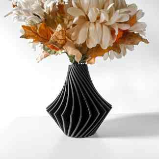 3D printed black vase with floral arrangement, showcasing modern design and decorative art.
