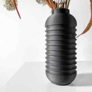 High-quality 3D printed black vase featuring textured, ribbed surface for contemporary interior decor.