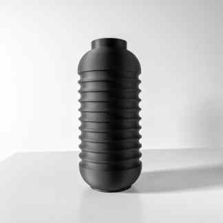 Black 3D printed vase with textured ribbed pattern for contemporary home decor.
