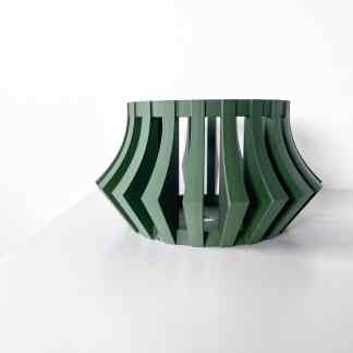 Stylish modern green 3D printed table with curved geometric pattern.