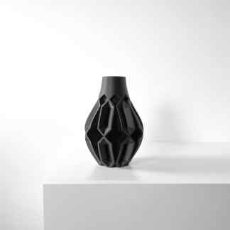 Black 3D-printed vase with complex geometric pattern, perfect for contemporary interior decoration and artistic accents.