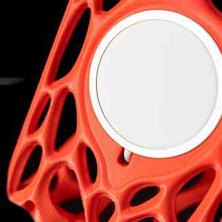 High-quality 3D printed speaker with innovative orange lattice shell for immersive audio experience.
