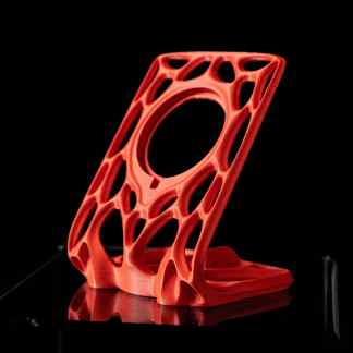 3D printed complex lattice structure on black background.