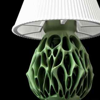 Stunning 3D printed lamp base showcasing complex green lattice pattern for modern decor.
