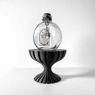 3D printed decorative item featuring a potion bottle with a vintage label on a modern stand.