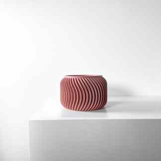 Vase 3D model, pink ceramic with spiral ridges, minimalist decor, innovative design.