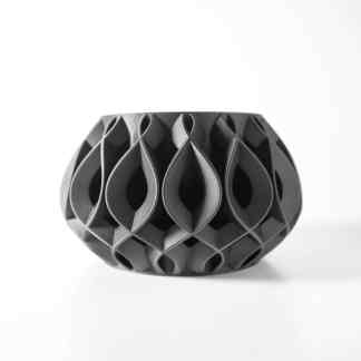 Elegant black 3D printed vase with intricate geometric pattern and modern aesthetic.
