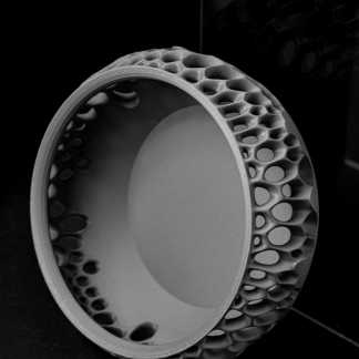 Detailed black and white image of a 3D-printed honeycomb pattern showcasing precision and modern additive manufacturing technology for innovative design solutions.
