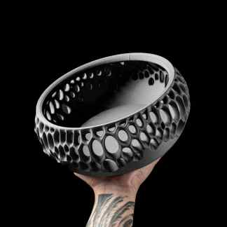 3D printed hollow bowl with intricate honeycomb design, modern style, black and white.