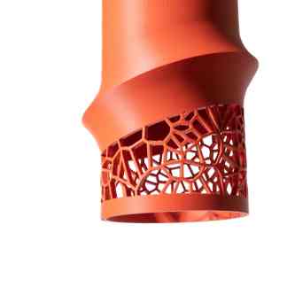 Bright orange VORIPENDANT lamp featuring a detailed, geometric cut-out design, perfect for stylish modern spaces.