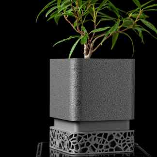Sleek 3D-printed plant pot with detailed geometric patterns, highlighting advanced additive manufacturing.