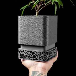 3D printed modern plant pot with geometric base for stylish interior decorations.