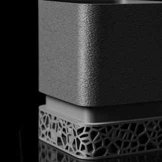 High-quality 3D printed metal cube showcasing textured finish and intricate geometric base, ideal for industrial and design applications.