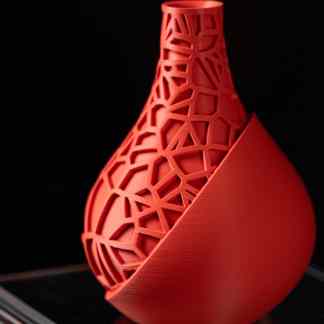 Modern 3D printed vase with complex geometric lattice structure, highlighting innovative digital fabrication skills.
