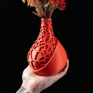 Innovative 3D-printed geometric vase with artificial flowers, perfect for modern interior design.