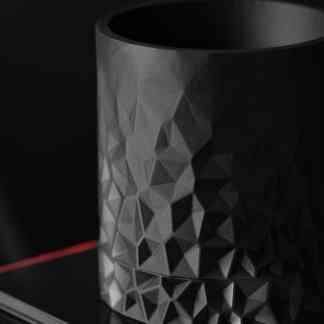 High-resolution metallic 3D-printed cylinder with geometric patterns for industrial design.